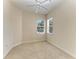 Neutral carpeted bedroom featuring natural light from the windows at 9429 Discovery Ter # 102B, Bradenton, FL 34212