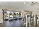 Well-equipped fitness area featuring modern treadmills with views of the outdoor pool at 9429 Discovery Ter # 102B, Bradenton, FL 34212