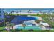 An aerial view showcases the community pool, shuffleboard, and manicured landscaping, near the beach and Gulf at 1000 Longboat Club Rd # 604, Longboat Key, FL 34228