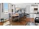 Dining area with a table and seating for six plus a mirrored wall, view to kitchen at 1000 Longboat Club Rd # 604, Longboat Key, FL 34228