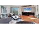 Living room features hardwood floors, sliding glass doors to a balcony, and modern decor with comfortable seating at 1000 Longboat Club Rd # 604, Longboat Key, FL 34228