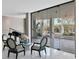 Inviting lobby area with comfortable seating, a grand piano, and view of outdoors at 1000 Longboat Club Rd # 604, Longboat Key, FL 34228