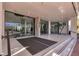Elegant lobby entrance with glass doors and a marble floor, showcasing modern design elements at 1000 Longboat Club Rd # 604, Longboat Key, FL 34228