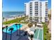A beachfront condo has a pool, shuffleboard court, and lush tropical landscaping at 1000 Longboat Club Rd # 604, Longboat Key, FL 34228