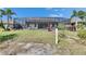 Expansive backyard featuring a screened in lanai with outdoor bar at 10510 Giddens Pl, Palmetto, FL 34221