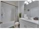 Bright bathroom showcasing a shower-tub combo, toilet, and a vanity with a white countertop and silver faucet at 10510 Giddens Pl, Palmetto, FL 34221