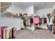 Walk-in closet with organized storage solutions for clothing, shoes, and accessories at 10510 Giddens Pl, Palmetto, FL 34221