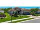 Beautiful home featuring a two-car garage, stone accents, and a well-maintained lawn at 10510 Giddens Pl, Palmetto, FL 34221