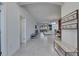 Open hallway featuring neutral walls and flooring, showcasing the spacious design and layout at 10510 Giddens Pl, Palmetto, FL 34221