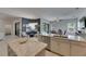 Bright kitchen with stainless steel appliances, granite countertops, and open flow to the dining area at 10510 Giddens Pl, Palmetto, FL 34221