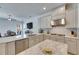 Modern kitchen with stainless steel appliances, granite counters, and an island with bar seating at 10510 Giddens Pl, Palmetto, FL 34221