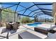 Beautiful screened in pool area features an outdoor lounge and dining space at 10510 Giddens Pl, Palmetto, FL 34221