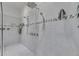 Modern tiled shower with multiple shower heads offers a spa-like experience at 10510 Giddens Pl, Palmetto, FL 34221