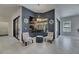 Cozy sitting area offers unique decor, with views of the pool and outdoor kitchen at 10510 Giddens Pl, Palmetto, FL 34221