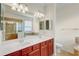 Bathroom features double sink vanity, shower and bathtub at 12091 Amica Loop, Venice, FL 34293