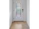 Stylish foyer featuring a decorative glass front door and tile flooring, creating an inviting entrance to the home at 12091 Amica Loop, Venice, FL 34293