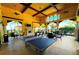 Entertaining game room with a ping pong table, seating, and a fireplace, perfect for socializing and having fun at 12091 Amica Loop, Venice, FL 34293