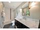 Elegant bathroom with a marble countertop, a new shower with decorative tile, and updated fixtures at 1240 Fox Creek Dr, Sarasota, FL 34240