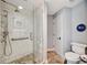 Bathroom featuring glass shower, tiled floor, and modern fixtures at 1240 Fox Creek Dr, Sarasota, FL 34240