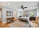 Well-lit bedroom with wood floors, classic decor, and comfortable furnishings at 1240 Fox Creek Dr, Sarasota, FL 34240