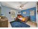 Brightly painted bedroom with wood floors, comfortable bed, and a playful shark-themed decor at 1240 Fox Creek Dr, Sarasota, FL 34240