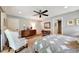 Cozy bedroom with chair, wooden furniture and soft lighting at 1240 Fox Creek Dr, Sarasota, FL 34240