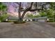 Charming single-story home featuring well-maintained exterior, circular driveway, and mature landscaping at 1240 Fox Creek Dr, Sarasota, FL 34240