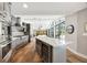 Large open kitchen with granite countertops, stainless appliances, and views to the outdoor area at 1240 Fox Creek Dr, Sarasota, FL 34240