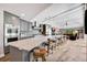 Gourmet kitchen featuring a large island, pendant lighting, and stainless-steel appliances at 1240 Fox Creek Dr, Sarasota, FL 34240
