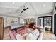 Open-concept living room boasts a high ceiling, wood floors, and an open floor plan at 1240 Fox Creek Dr, Sarasota, FL 34240