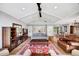 Spacious living room featuring a high ceiling, wood floors, and a decorative red and blue rug at 1240 Fox Creek Dr, Sarasota, FL 34240