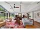 Open-concept living room features wood floors, neutral walls, and views to an outdoor area at 1240 Fox Creek Dr, Sarasota, FL 34240