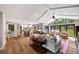 This living room opens to a dining area with views to the pool and backyard at 1240 Fox Creek Dr, Sarasota, FL 34240
