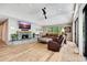 Inviting living room with stone fireplace, wood floors, and comfortable seating area at 1240 Fox Creek Dr, Sarasota, FL 34240