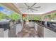 Outdoor kitchen with a built-in grill, sink, and plenty of counter space for entertaining at 1240 Fox Creek Dr, Sarasota, FL 34240