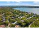 Aerial view of a beautiful neighborhood surrounded by lush trees and the ocean at 1434 Ladue Ln, Sarasota, FL 34231