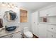 Stylish bathroom with unique vessel sink, granite countertop, window with shade, and storage cabinets at 1434 Ladue Ln, Sarasota, FL 34231