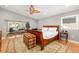 Spacious bedroom with sitting area, large windows, and hardwood floors at 1434 Ladue Ln, Sarasota, FL 34231