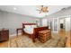 Bedroom showcasing hardwood floors, king bed, and decorative accent chest at 1434 Ladue Ln, Sarasota, FL 34231