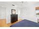 Bright bedroom featuring neutral walls, wood floors, and a ceiling fan at 1434 Ladue Ln, Sarasota, FL 34231