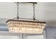 Close up of the decorative chandelier in the dining room at 1434 Ladue Ln, Sarasota, FL 34231