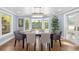 Dining room with a large bay window and a chandelier at 1434 Ladue Ln, Sarasota, FL 34231