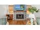 Close-up of the fireplace, showcasing the detailed tilework and the modern television, creating a cozy focal point at 1434 Ladue Ln, Sarasota, FL 34231