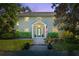 Inviting two-story home featuring a classic design with a welcoming front entrance and well-manicured landscaping at 1434 Ladue Ln, Sarasota, FL 34231