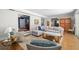 Comfortable living room with wood floors, a sectional sofa, and views into other rooms of the home at 1434 Ladue Ln, Sarasota, FL 34231