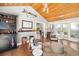 Cozy living room featuring bar seating and vaulted ceilings at 1434 Ladue Ln, Sarasota, FL 34231