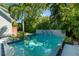 Beautiful pool featuring spa jets and lush tropical landscaping for a private oasis at 1434 Ladue Ln, Sarasota, FL 34231