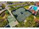 Overhead view of tennis courts near a pool and parking at 1434 Ladue Ln, Sarasota, FL 34231