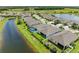 Aerial view highlights properties backing onto the canal, screened enclosures, and well-kept green spaces at 15612 Trinity Fall Way, Bradenton, FL 34212