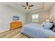 Bedroom features include wood floors, ceiling fan and TV at 15612 Trinity Fall Way, Bradenton, FL 34212